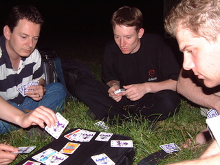 Playing cards in the park at night
